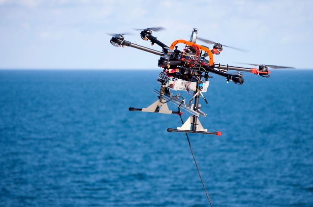 Tests of AVAL system components at sea. The photo shows a drone hovering above the sea