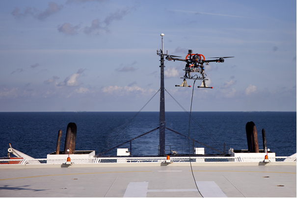 Tests of AVAL system components carried out at sea. The photo shows a drone hovering above the water shortly after taking off from the ship