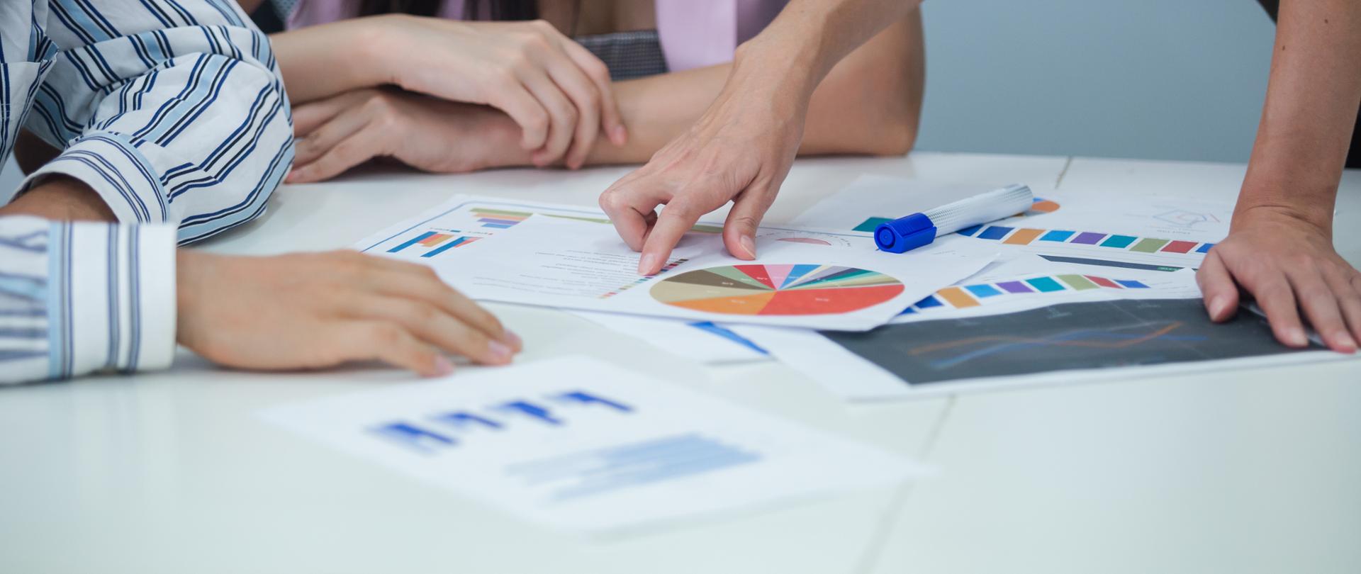 Group of business people brainstorming analyze market graph. at table to work. Effective people in organization use idea to consult their work. employees drive company.