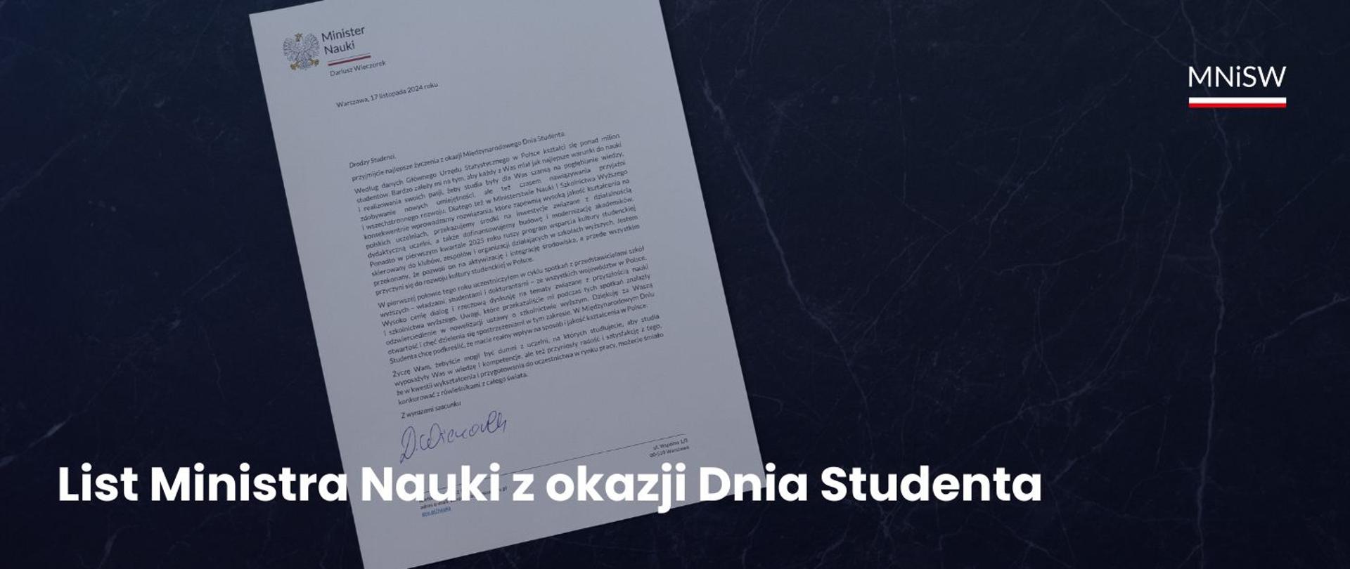 Grafika - na granatowym tle leży zadrukowana kartka z odręcznym podpisem, obok napis List Ministra Nauki z okazji Dnia Studenta.