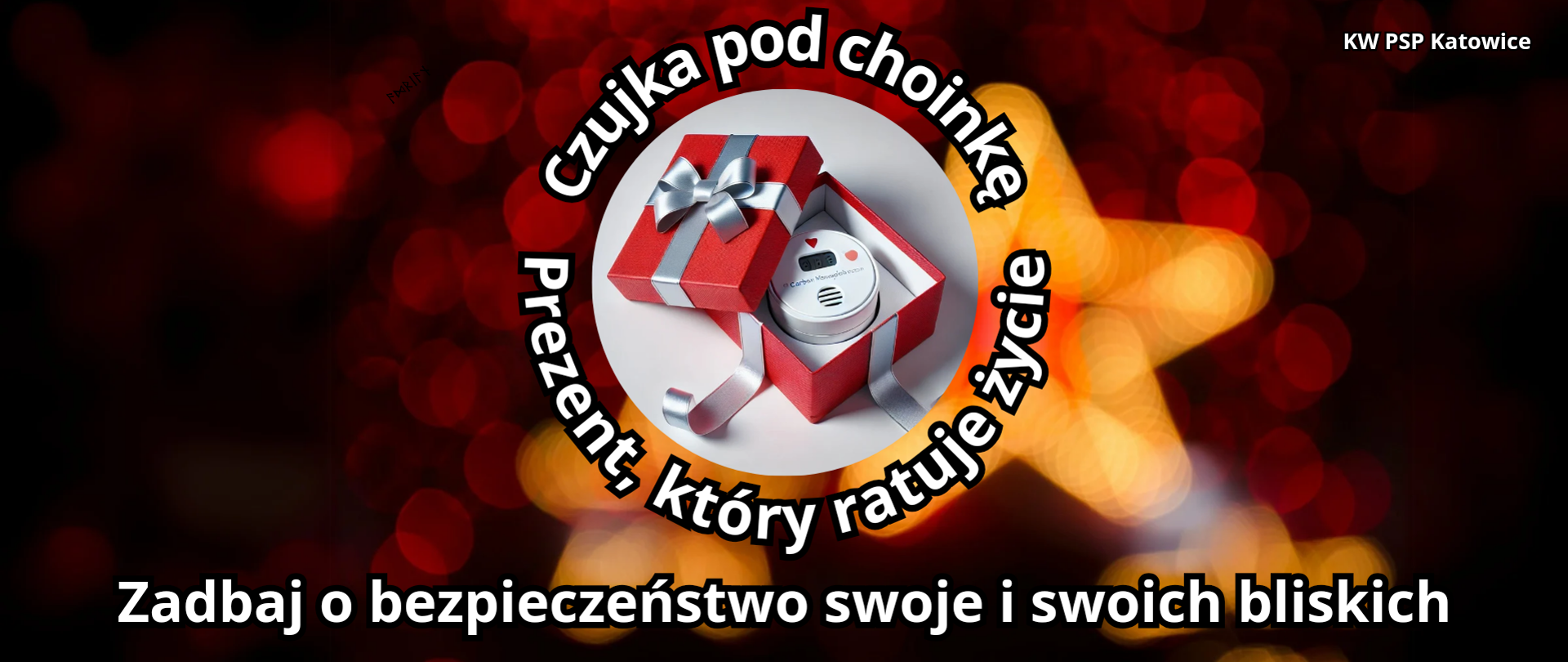 Na rozmytym bordowo złotym tle światełek świątecznych, w białym kole na środku otwarte pudełko na prezent. W środku czujka. Wokół biały napis: Czujka pod choinkę. Prezent, który ratuje życie. na dole biały napis Zadbaj o bezpieczeństwo swoje i swoich bliskich.