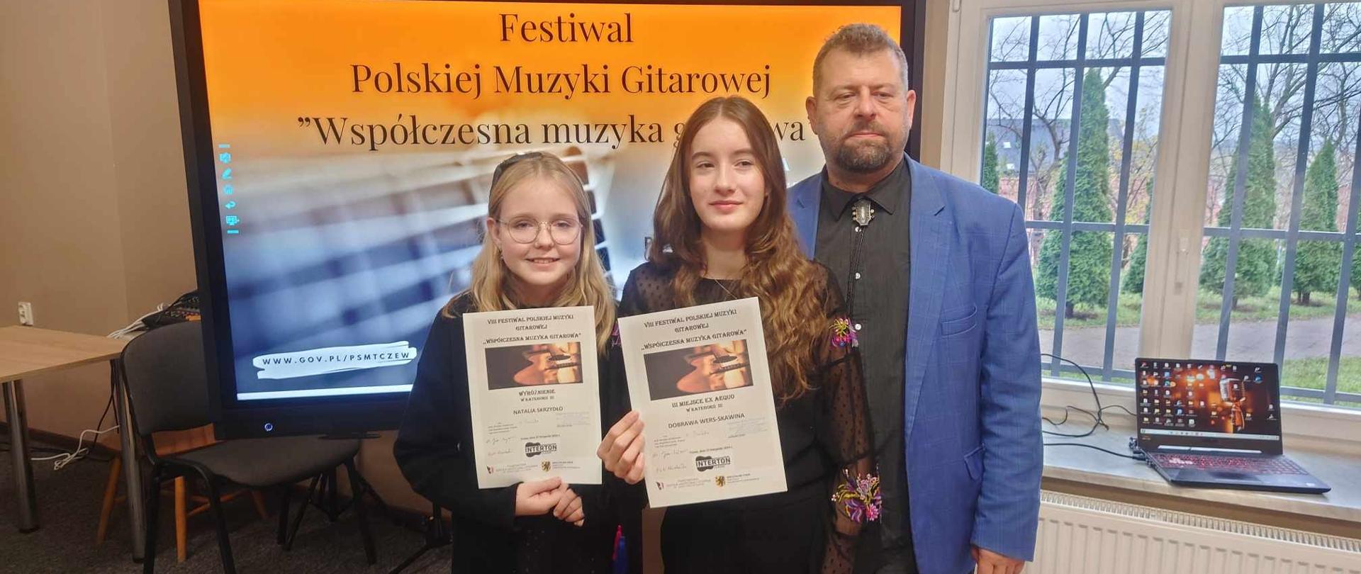 Galeria 9 zdjęć z konkursu gitarowego na VIII Festiwalu Polskiej Muzyki Gitarowej, w którym wzięło udział dwóch uczniów klasy gitary Witolda Kozakowskiego Dobrawa Wers-Skawina i Natalia Skrzydło w dniu 27 listopada 2024.