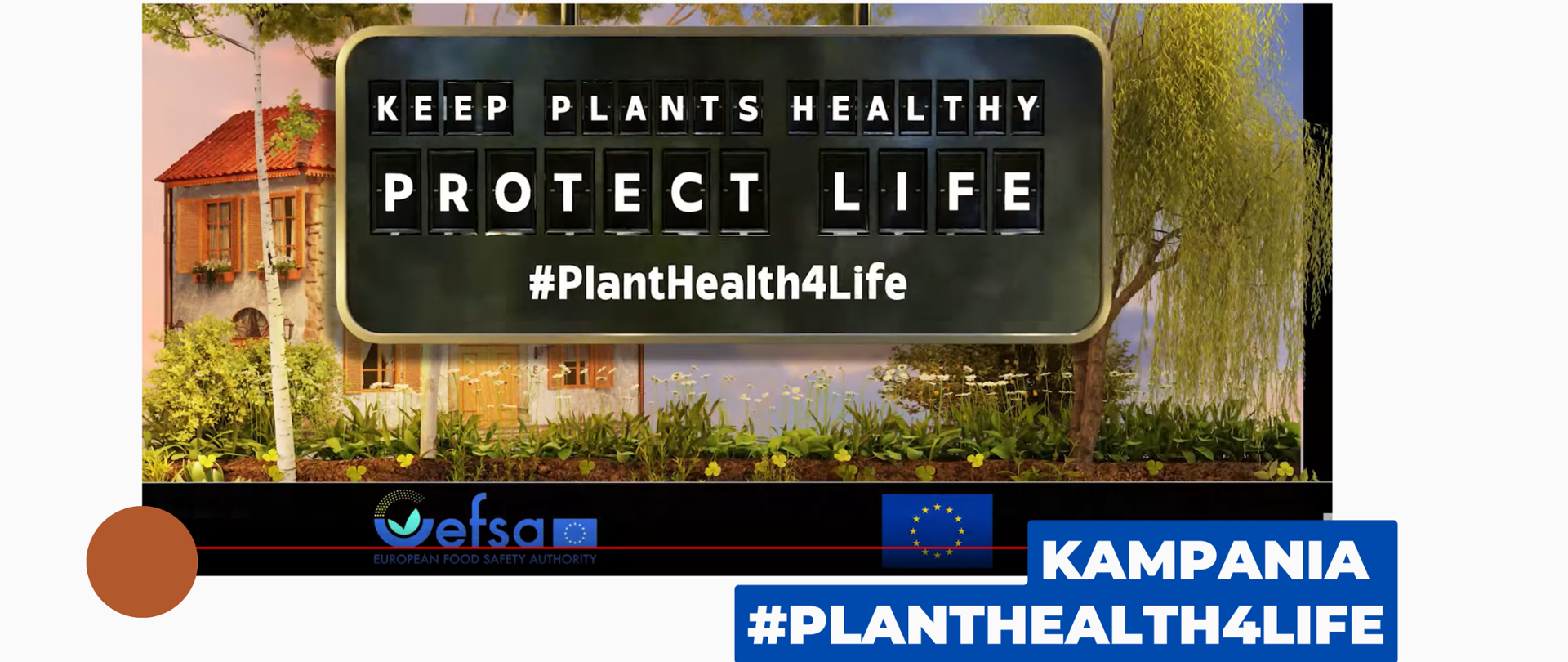 Na zdjęciu na pierwszym planie widać czarna planszę z napisem Keep plants healthy protect life PlantHealth4Life. W tle widać dom i drzewo