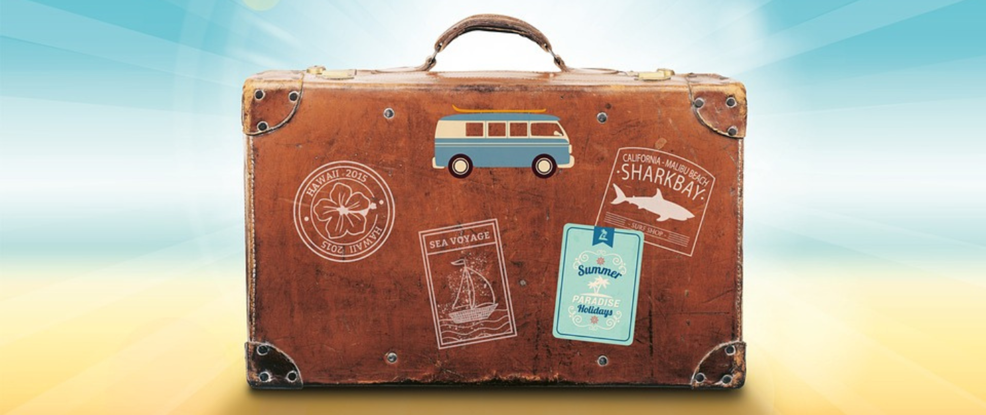 Grafika przedstawia walizkę podróżną.