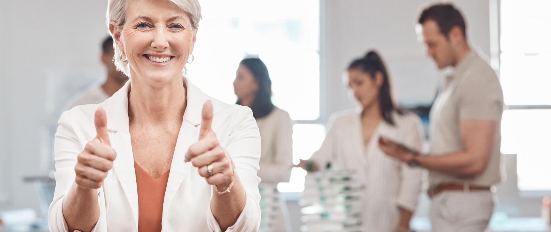 Thumbs up, motivation and yes with a woman leader, manager or CEO working in an office with her tea.