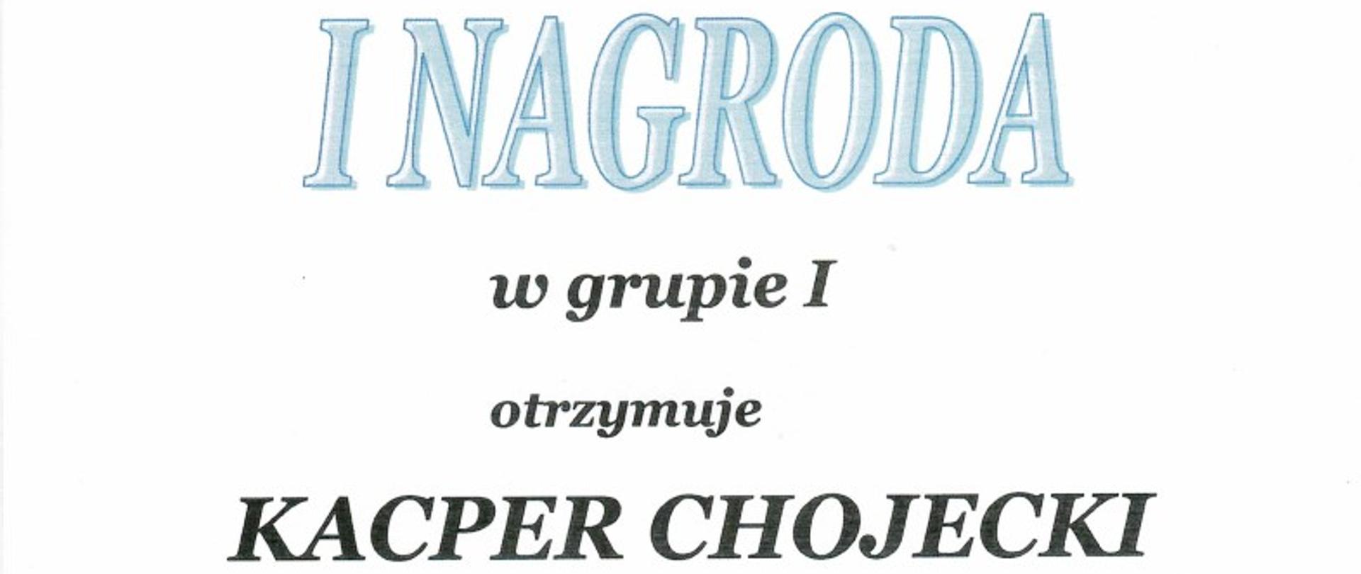 Zdjęcie dyplomu Kacpra Chojeckiego za zajęcie I nagrody w grupie I na VII Mazowieckim Konkursie Gitarowym „Gitara na Pradze”. Na białym tle, na górze dyplomu nazwa organizatora konkursu: Państwowa Szkoła Muzyczna I st. nr 3 im. Juliusza Zarębskiego w Warszawie i Towarzystwo Gitarowe. Poniżej zdjęcie budynku szkoły i ikona gitary W dolnej części dyplomu skład jury z podpisami oraz tekst: Warszawa, 05 kwietnia 2023 r.