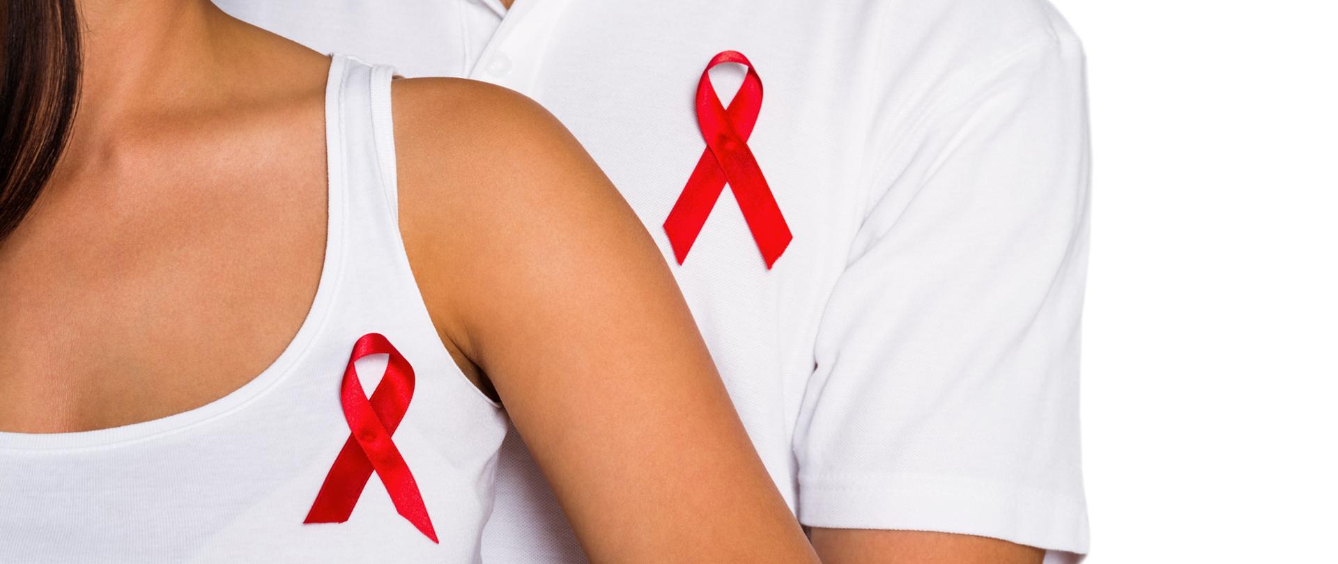 Couple supporting aids awareness together on white background