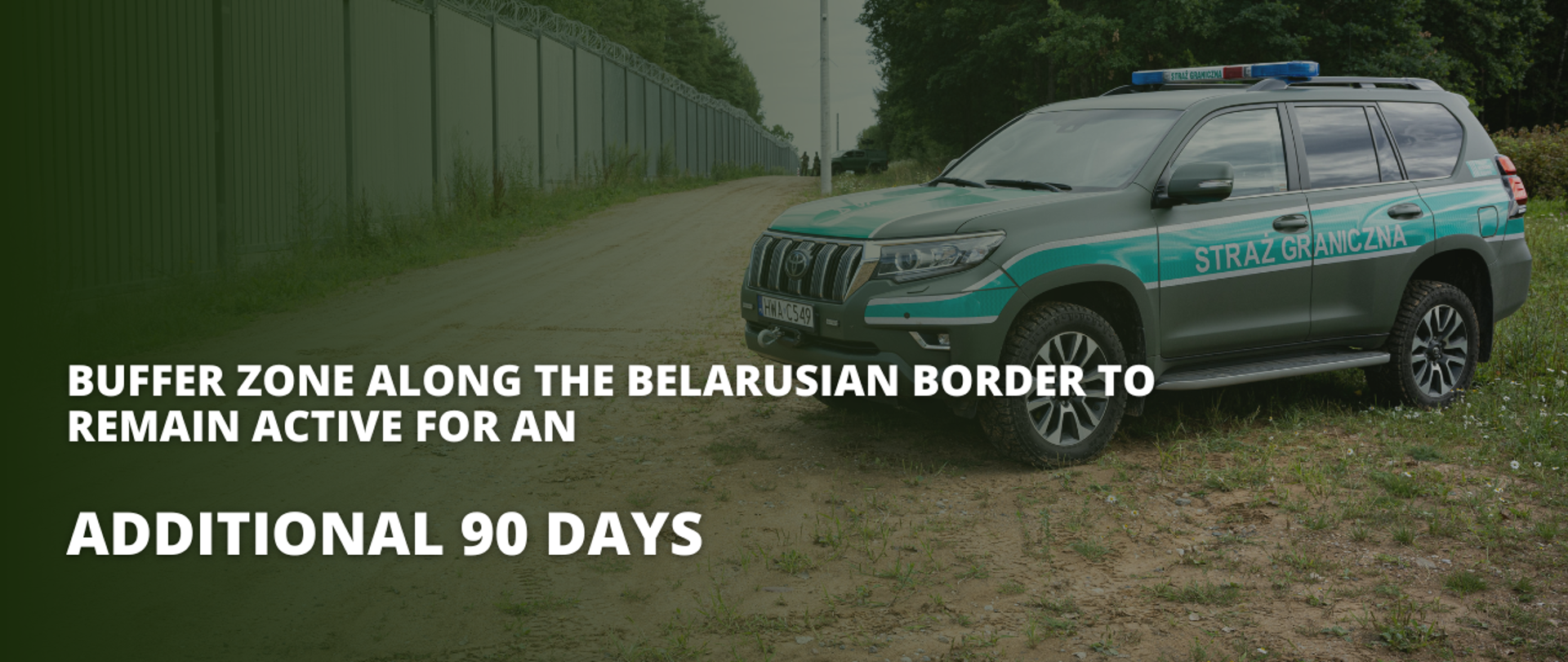 The photo shows an off-road vehicle of the border guards and a sign Buffer zone along the Belarusian border to remain active for an additional 90 days