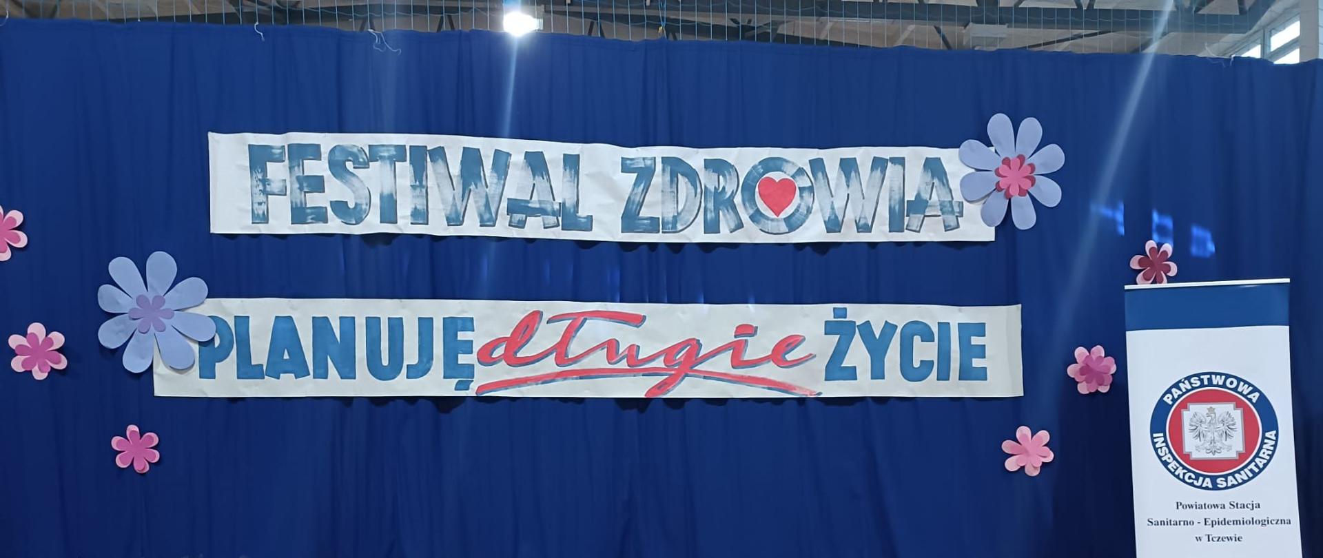 Zdjęcie na którym znajduje się napis festiwal zdrowia, planuję długie życie oraz logo Inspekcji Sanitarnej