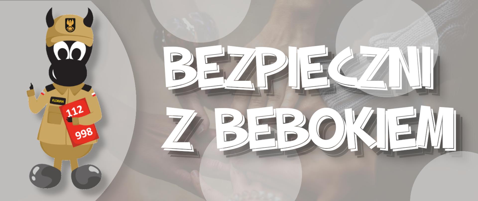 na banerze po lewej stronie postać beboka ubranego w piaskowy mundur strażacki, obok napis "Bezpieczni z Bebokiem"