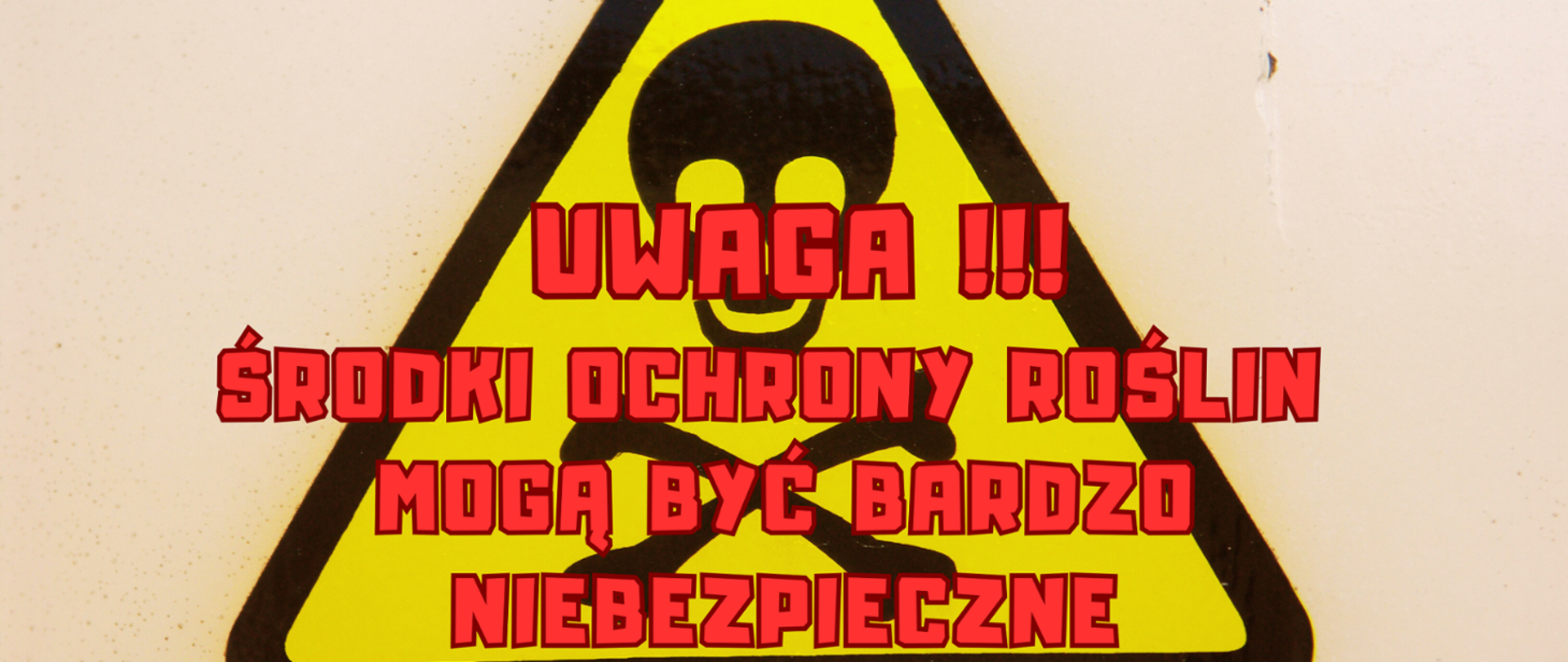 Żółty trójkąt w czarnym obramowaniu. Czerwony napis Uwaga Środki Ochrony Mogą Być Bardzo Niebezpieczne