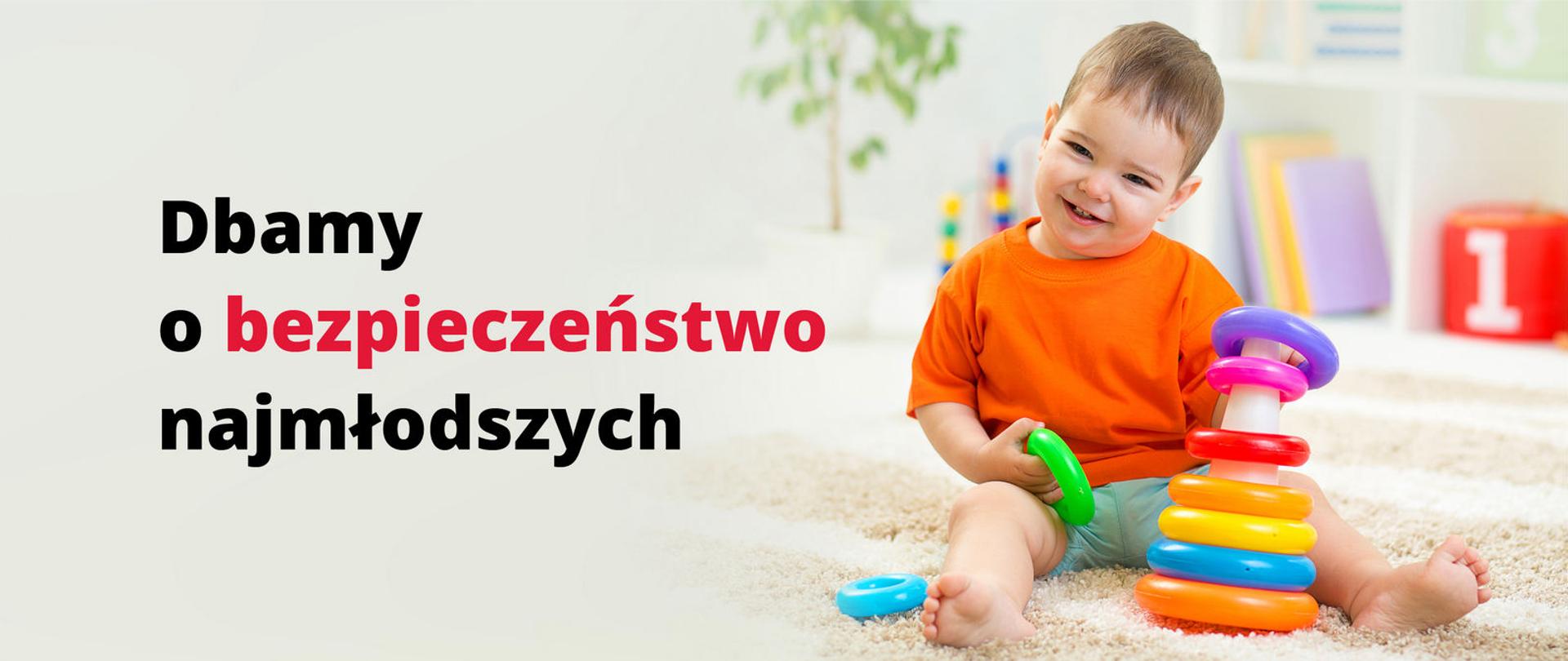 Dziecko bawiące się zabawką, napis Dbamy o bezpieczeństwo najmłodszych